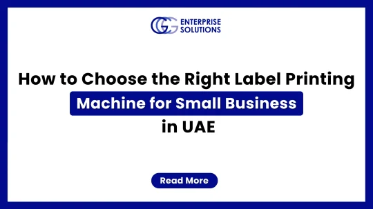A clean corporate web banner with a solid blue outer border and white background, featuring the GCG Enterprise Solutions logo above text detailing how to choose the right label printing machine for a small business in the UAE.